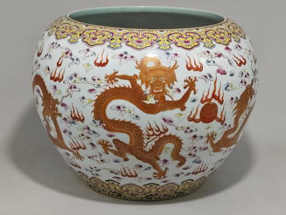 A Qing Dynasty Qianlong-era famille rose gilded five-dragon-playing-with-a-pearl-pattern painting: , 32 cm high and 42 cm in diameter.