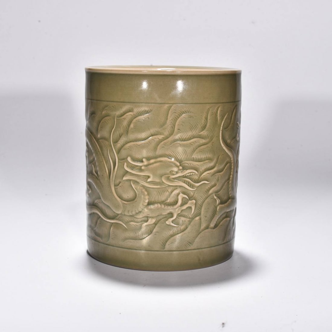 A Yue ware brush pot from the Five Dynasties period, decorated with a carved dragon (1 of 6)