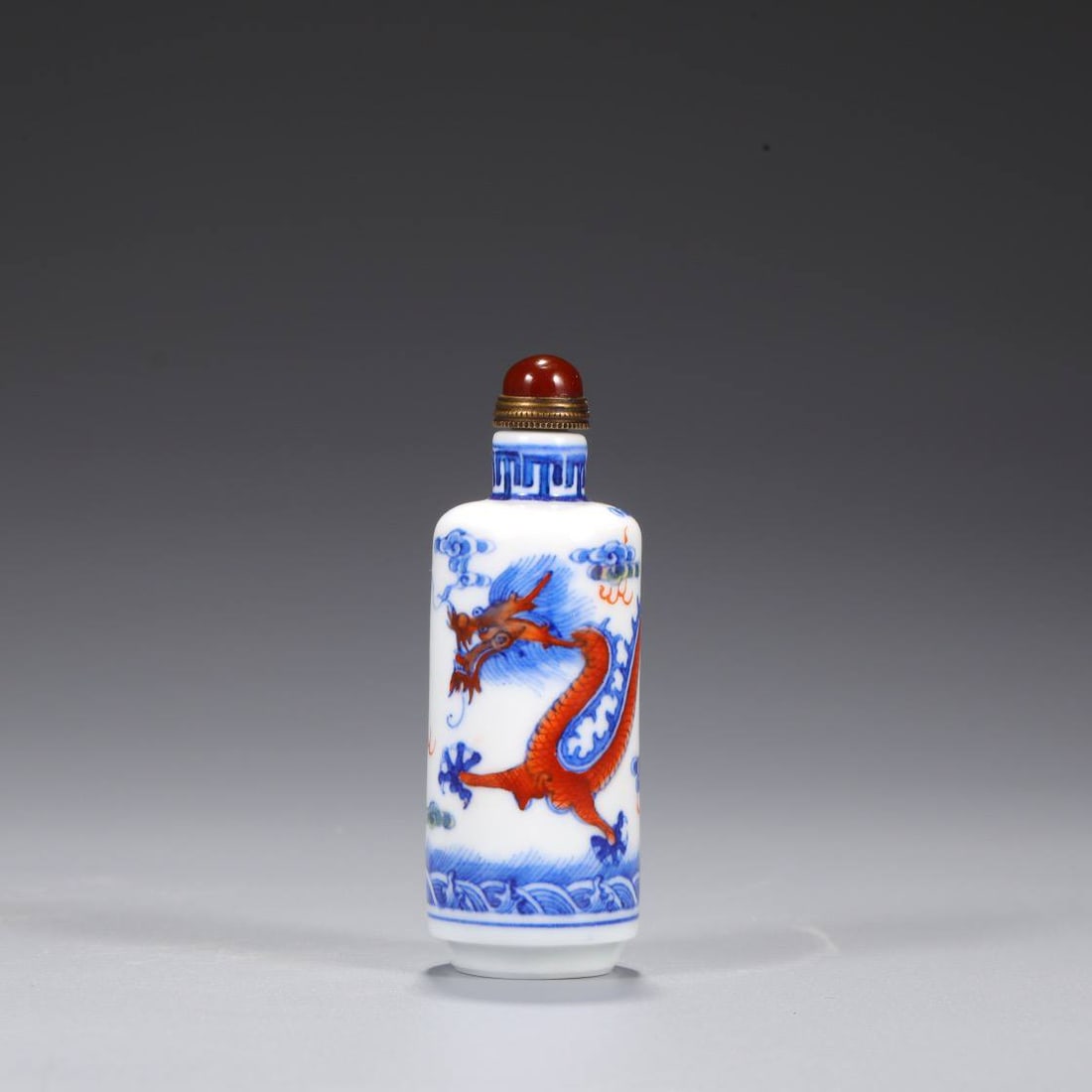 a Qing Dynasty Qianlong period doucai snuff bottle with dragon design (1 of 6)