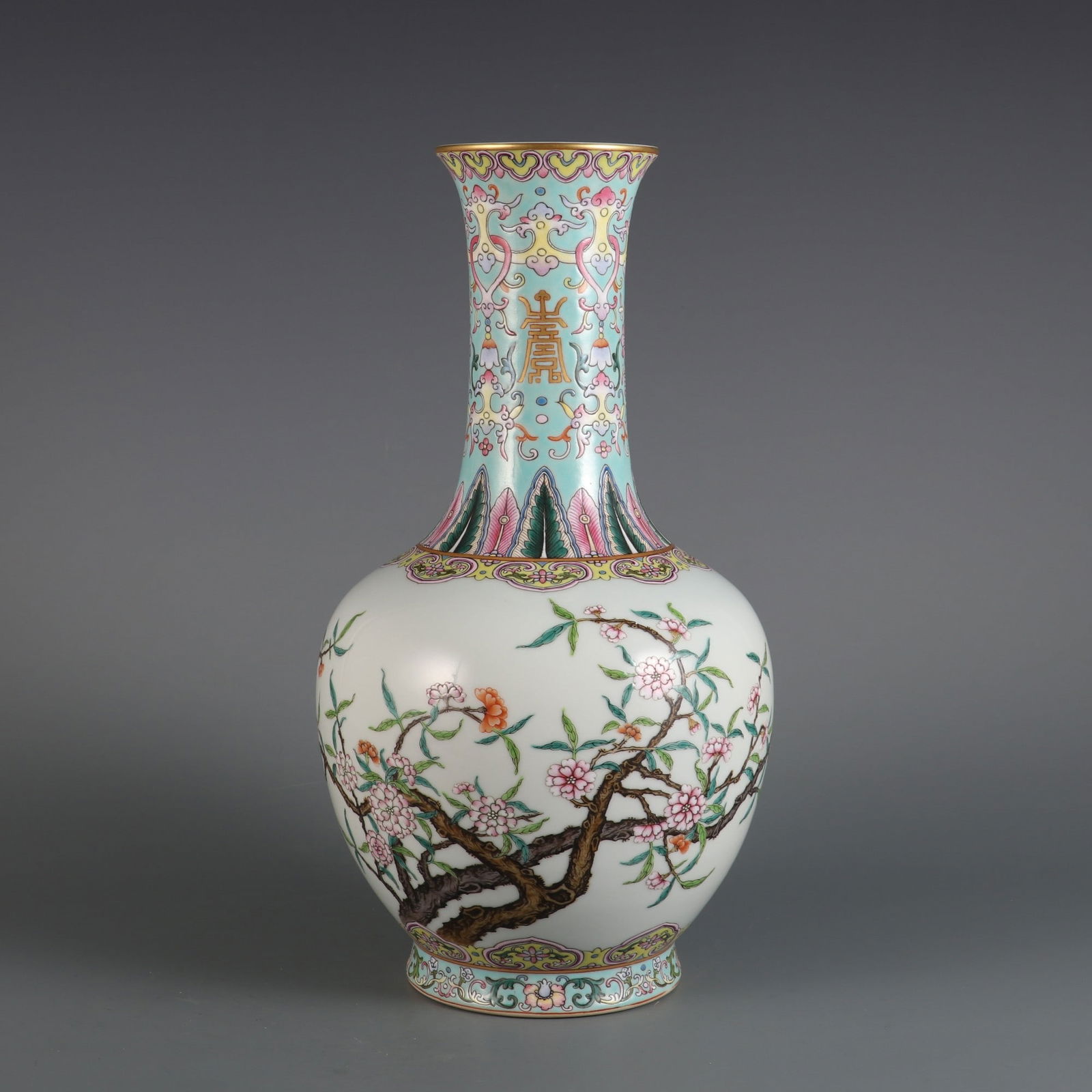 A famille rose vase with peach blossom design, made during the Qianlong period of the Qing dynasty. (1 of 8)