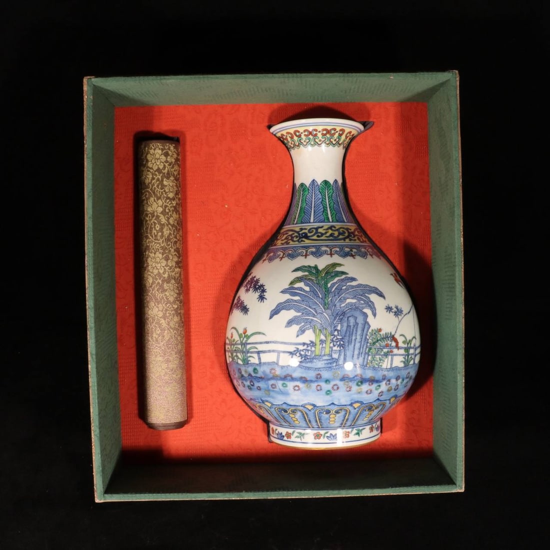 a Qing Dynasty Qianlong period Doucai (enamel overglaze) bamboo, rock, and banana leaf design: a Qing Dynasty Qianlong period Doucai (enamel overglaze) bamboo, rock, and banana leaf design Yuhuchun vase (with calligraphy and painting)Dimensions: Height 34 cm, Diameter 21 cm