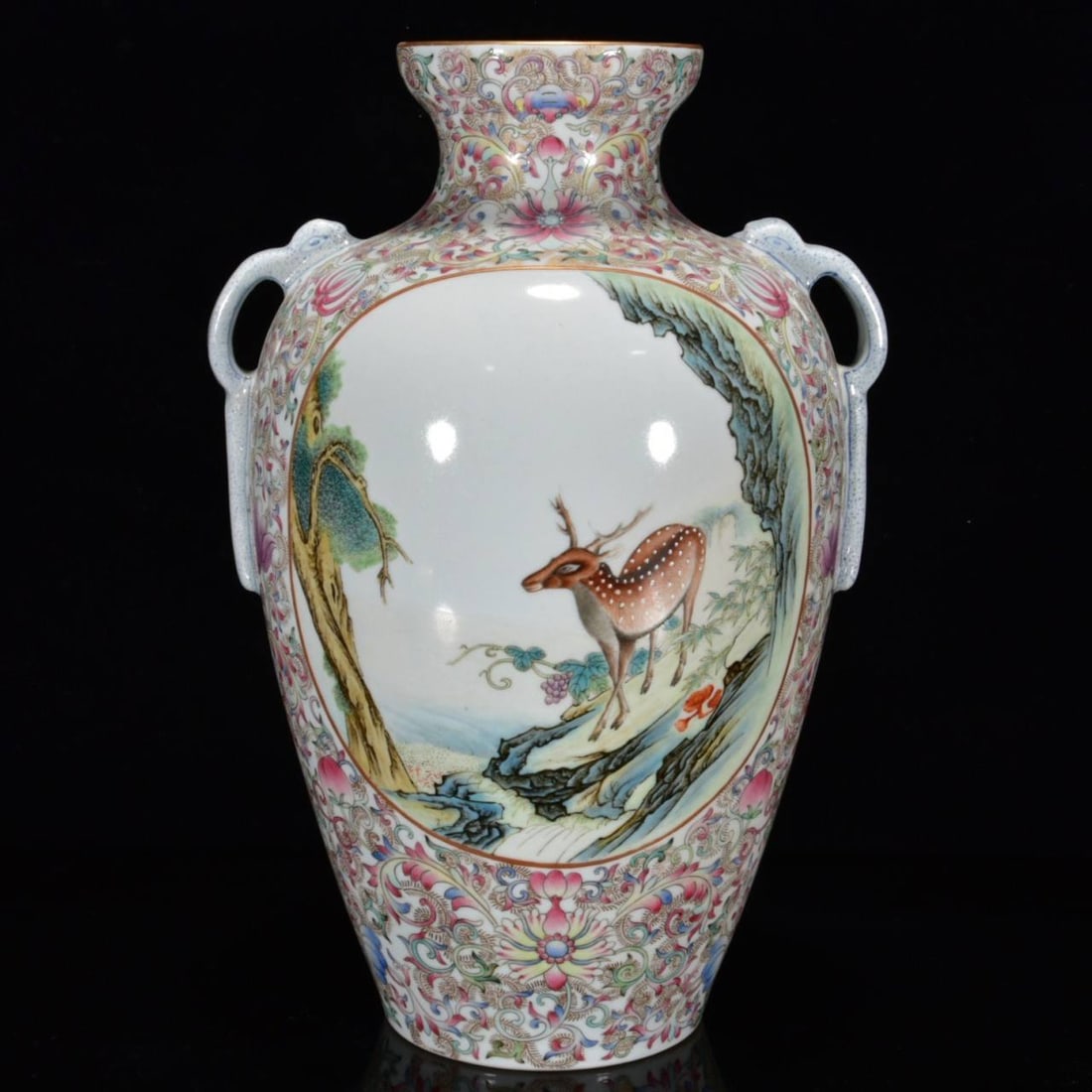 A famille rose vase with auspicious patterns of fortune, prosperity, and longevity (Fu Lu Shou): A famille rose vase with auspicious patterns of fortune, prosperity, and longevity (Fu Lu Shou) from the Qianlong period of the Qing dynasty, measuring 32 x 20 cm.