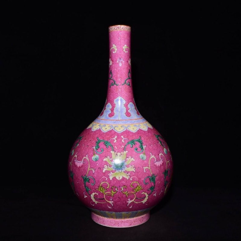 A Qing Dynasty Qianlong period famille rose enamel vase with rouge-red floral design: A Qing Dynasty Qianlong period famille rose enamel vase with rouge-red floral design, 41 x 25 cm in height.