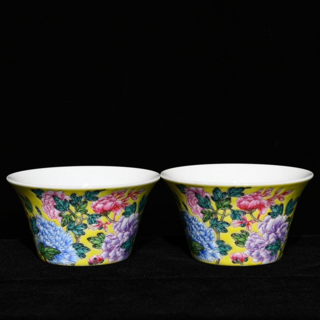 A Qing Dynasty, Yongzheng period, yellow-ground enamel-painted horseshoe-shaped cups: A Qing Dynasty, Yongzheng period, yellow-ground enamel-painted horseshoe-shaped cup with floral design, 4.7cm high and 8.8cm in diameter.