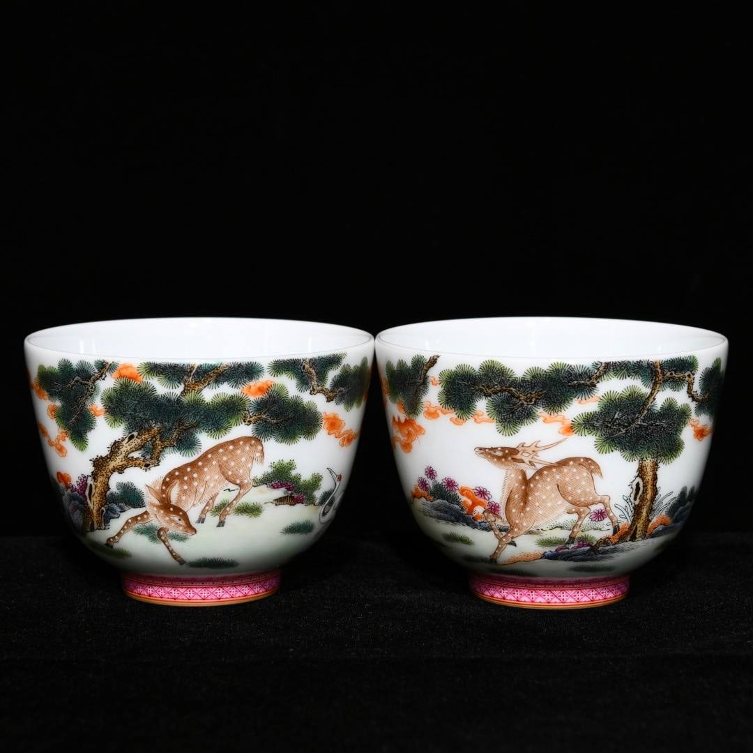 A Qianlong period (1736-1745) famille rose cups with pine and deer design: A Qianlong period (1736-1745) famille rose cups with pine and deer design, 5.4 cm high and 7.3 cm in diameter.
