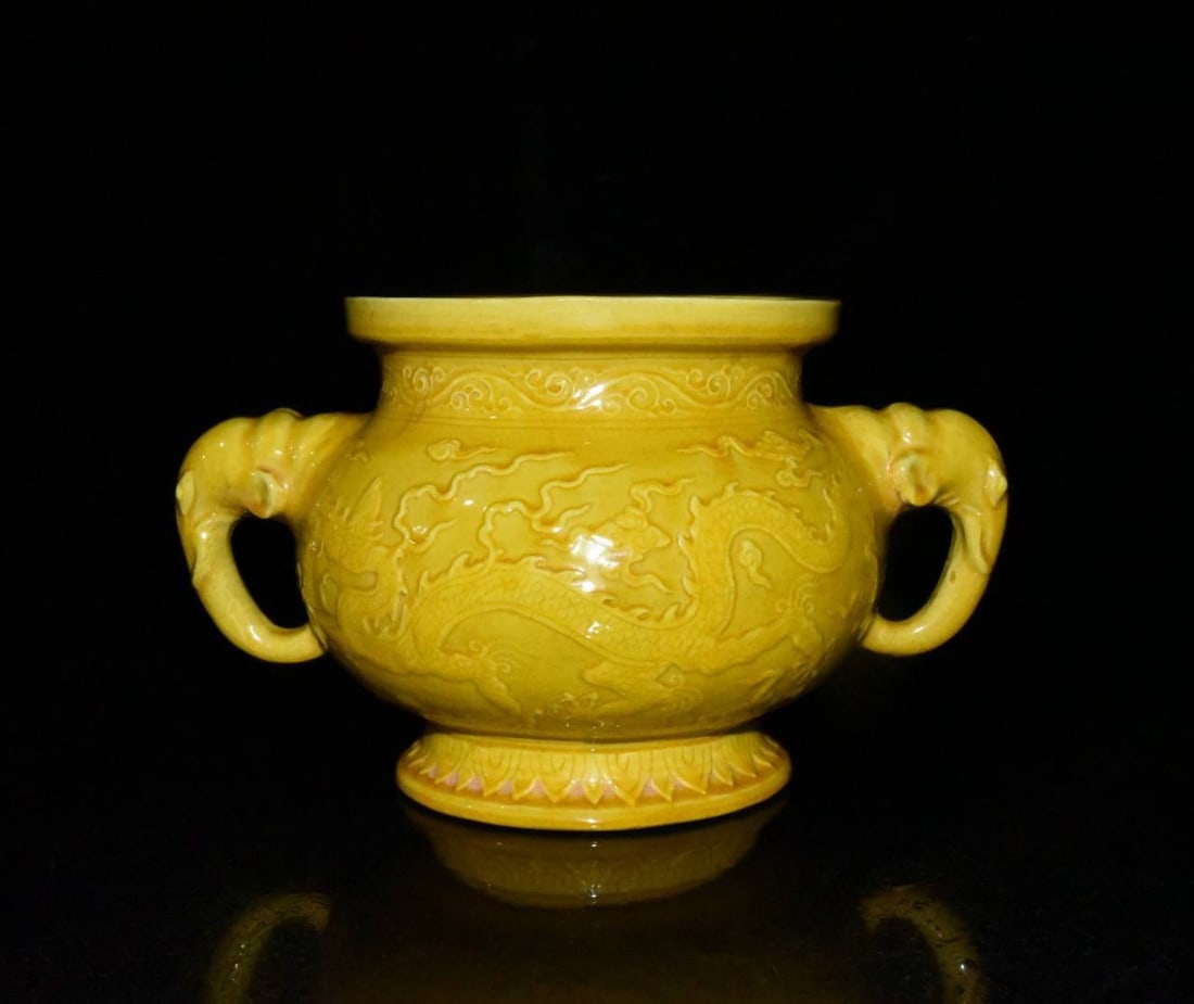A Ming Dynasty Yongle period yellow-glazed incense burner with relief dragon and cloud design (1 of 9)