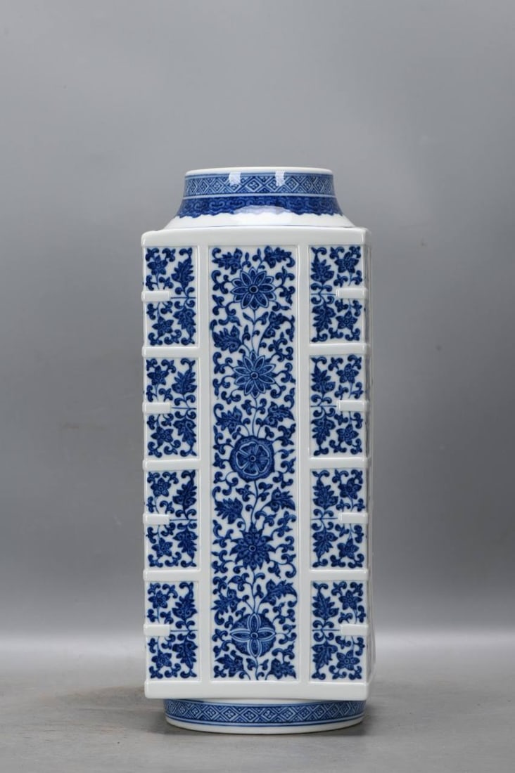 A blue and white porcelain vase with a lotus scroll design: A blue and white porcelain vase with a lotus scroll design and scraped rim, dating from the Qianlong period of the Qing Dynasty. Height: 36.2 cm, Mouth diameter: 9.6 cm, Belly diameter: 14 cm.