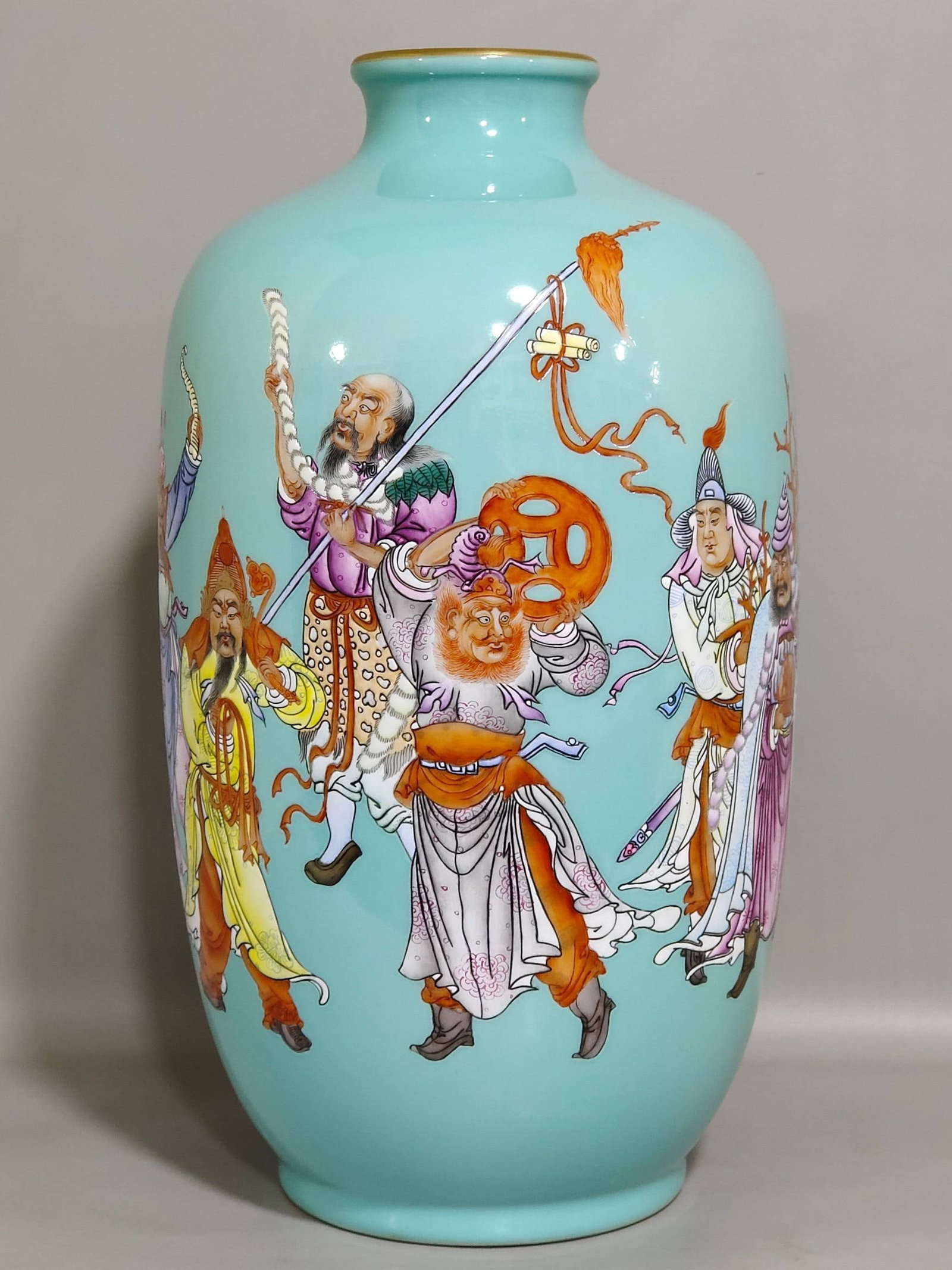 A Qing Dynasty Yongzheng period turquoise vase depicting figures from the Eight Barbarian Tribes: A Qing Dynasty Yongzheng period turquoise vase depicting figures from the Eight Barbarian Tribes, inscribed with poems. Height 33 cm, diameter 16 cm.