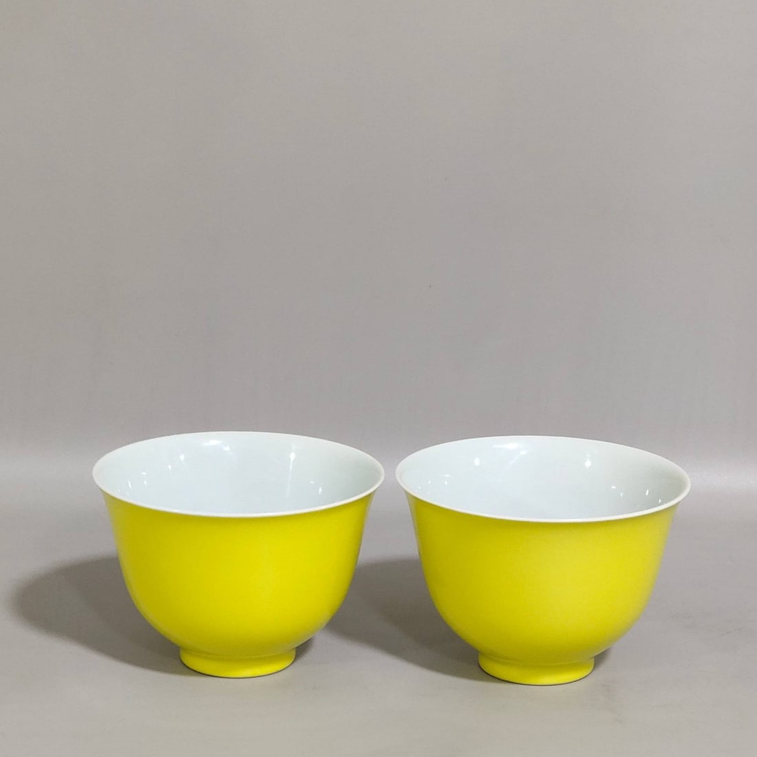 A lemon-yellow glazed cup from the Yongzheng period of the Qing Dynasty: A lemon-yellow glazed cup from the Yongzheng period of the Qing Dynasty, 5.7 cm high and 8.4 cm in diameter,