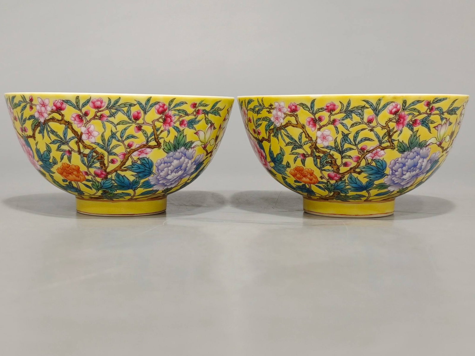 A Qing Dynasty Yongzheng period famille rose yellow-ground palace bowls: A Qing Dynasty Yongzheng period famille rose yellow-ground palace bowl with a floral and auspicious design, measuring 6.6 cm in height and 12.8 cm in diameter.