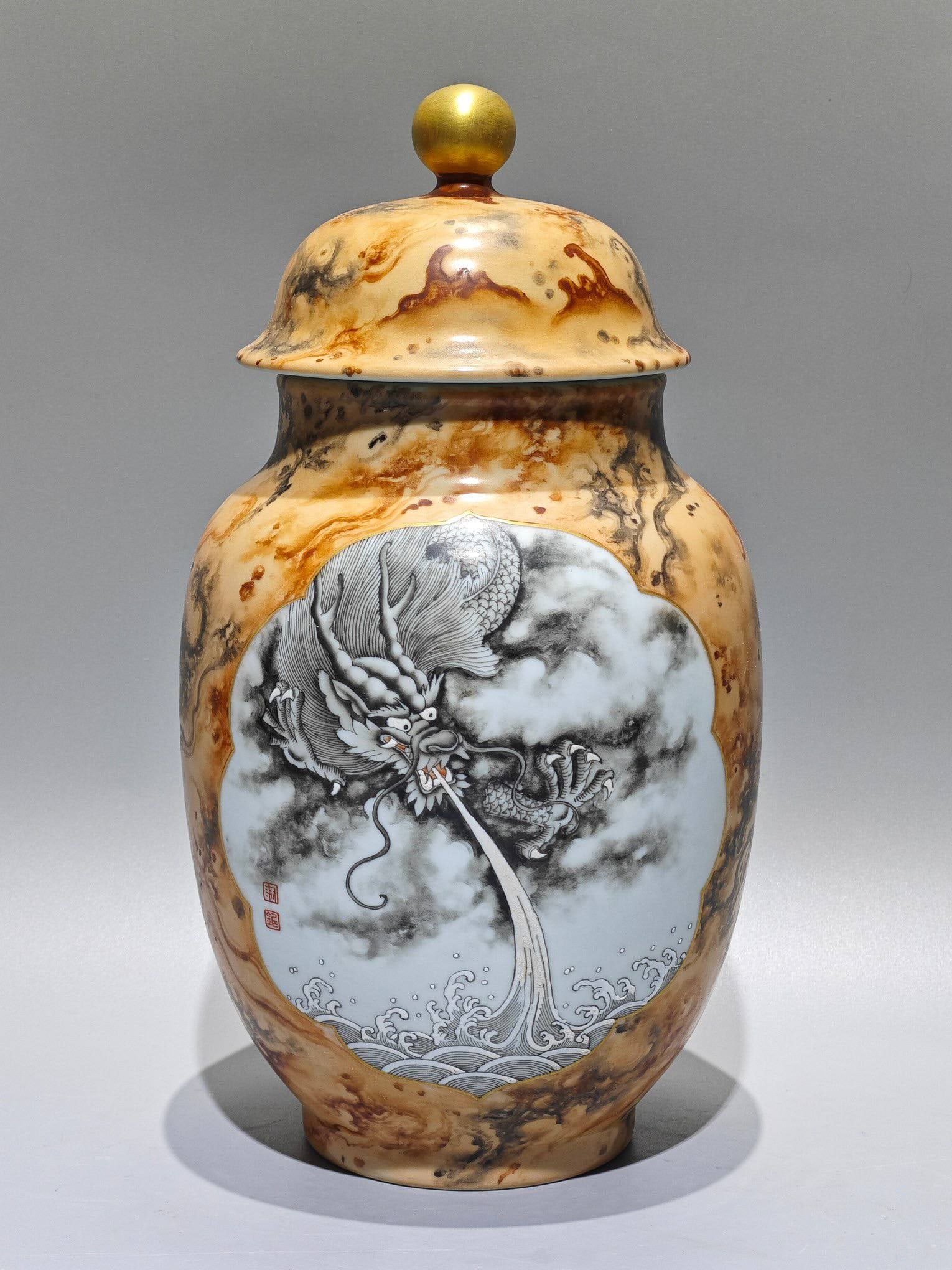 A Qing Dynasty Qianlong period (1736-1745) ink-painted stone-patterned glaze general jar: A Qing Dynasty Qianlong period (1736-1745) ink-painted stone-patterned glaze general jar with openwork dragon design, height: 31.8cm, belly diameter: 18cm.