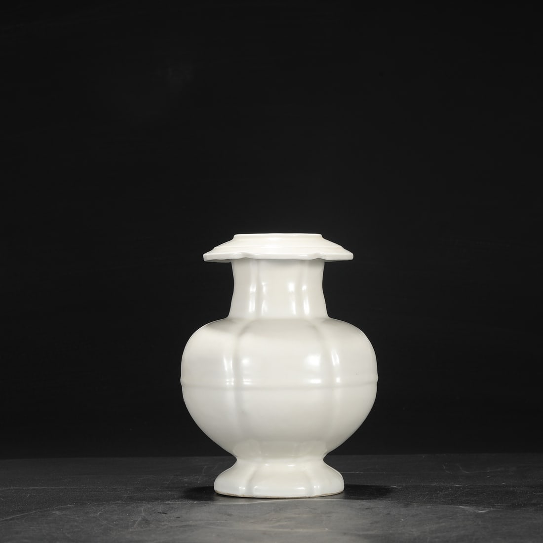 A Ming Dynasty Yongle period sweet-white glazed imperial pomegranate-shaped vase, formerly in the (1 of 7)
