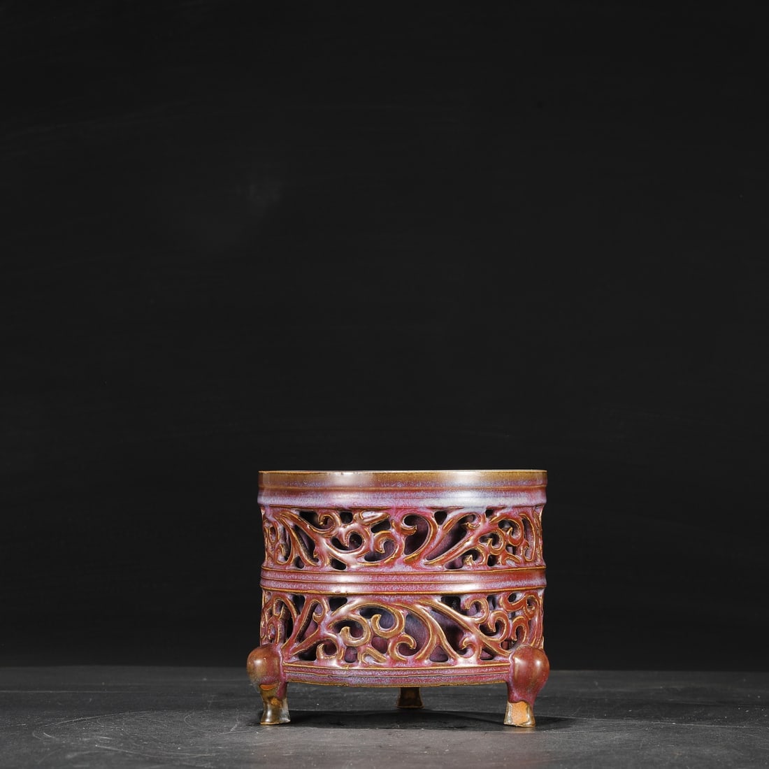 A Northern Song Dynasty Jun ware three-legged incense burner with grape-red glaze and openwork: Dimensions: Height 15.5 cm, Mouth Diameter 17.5 cm.