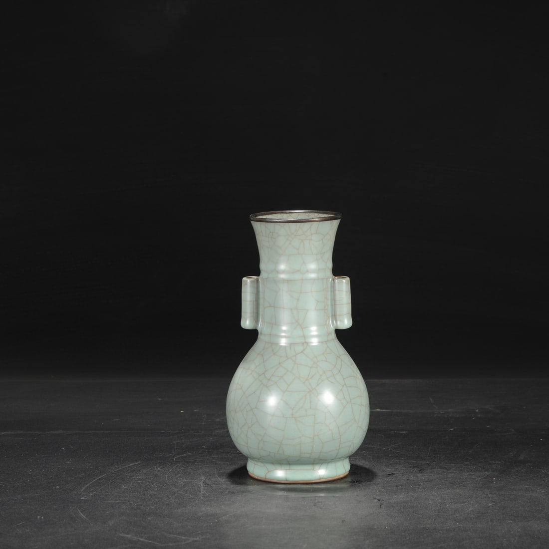 A Southern Song Dynasty official kiln celadon vase with a silver rim, used in the imperial court,: Dimensions: Height 23.5 cm, Mouth diameter 8 cm, Belly diameter 11.5 cm.