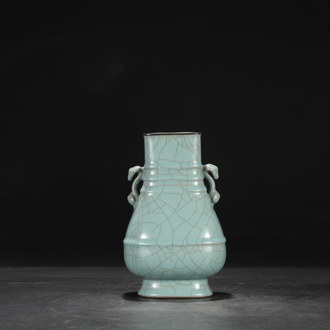 A Southern Song Dynasty official kiln celadon vase with a silver rim, used in the imperial court,: Dimensions: Height 26 cm, Mouth diameter 9 cm, Belly diameter 15 cm.