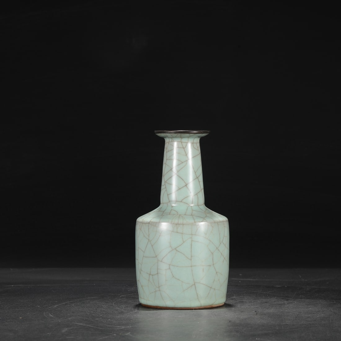 A Southern Song Dynasty official kiln celadon vase with a silver rim, used in the imperial court and: Dimensions: Height 23 cm, Mouth diameter 7 cm, Belly diameter 12 cm.
