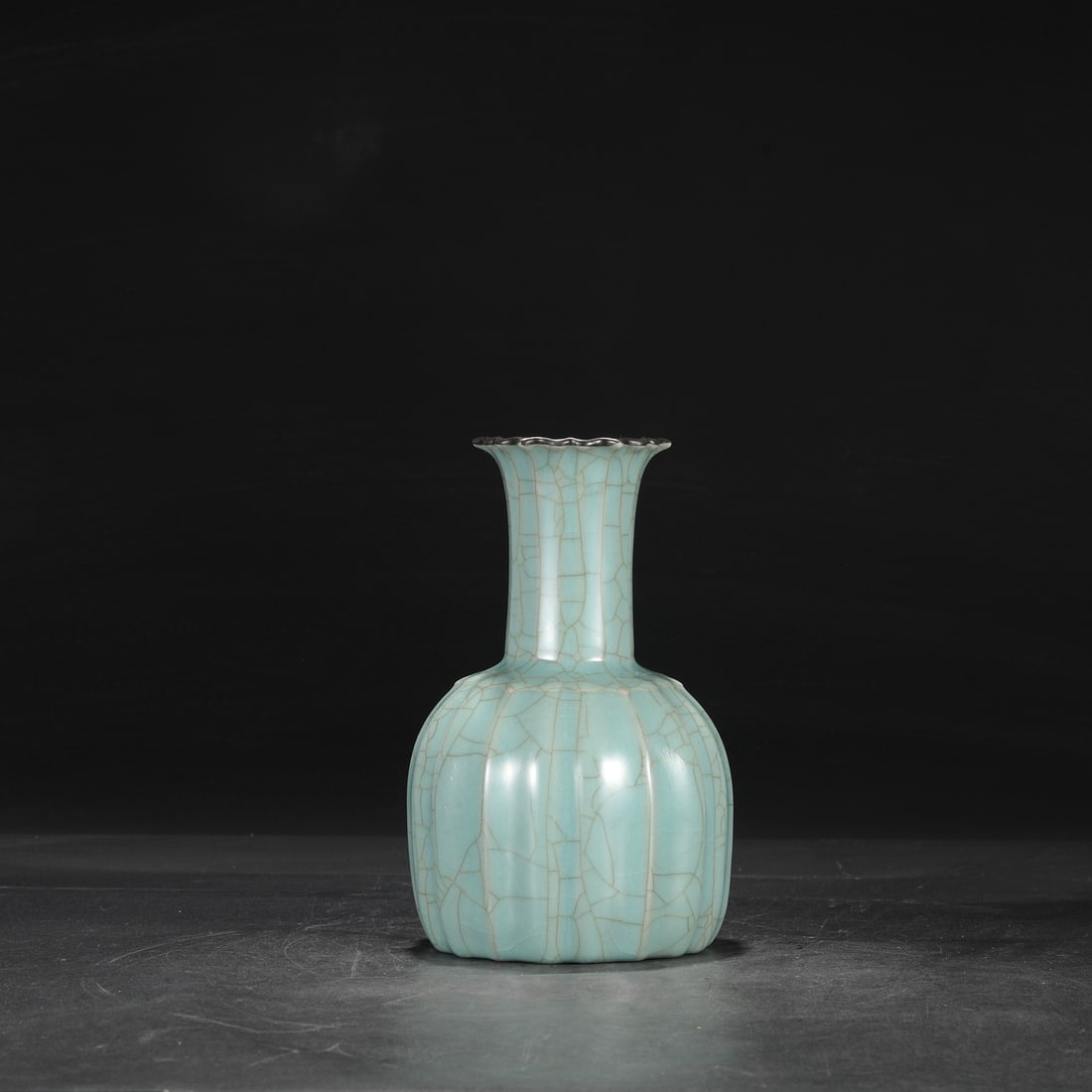 A Southern Song Dynasty official kiln celadon vase with a silver rim, used in the imperial court and: Dimensions: Height 23 cm, Mouth diameter 8 cm, Belly diameter 13.5 cm.
