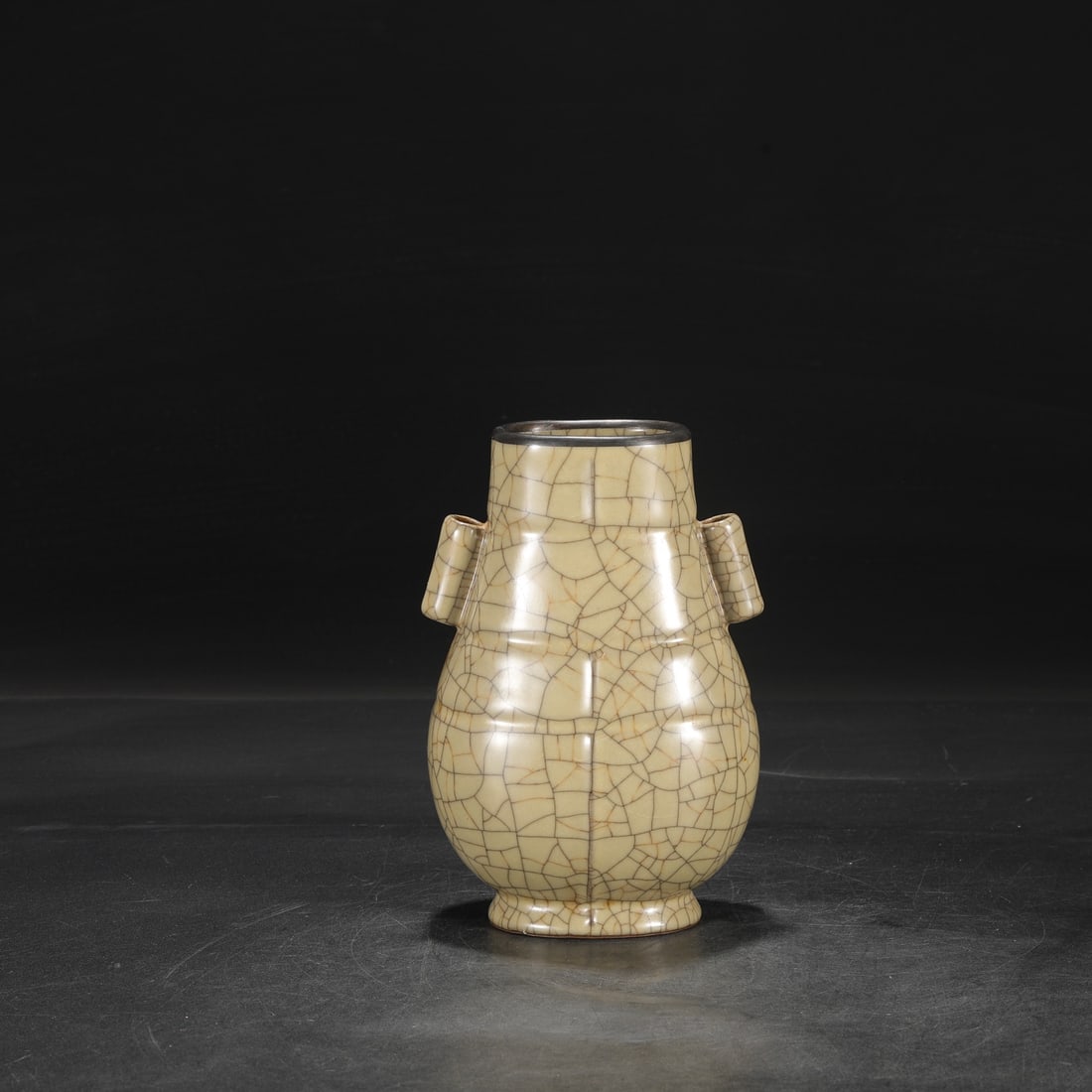 A Northern Song Dynasty Ge ware vase with a beige glaze, silver rim, and imperial handles, formerly: Dimensions: Height 21 cm, Mouth diameter 8 cm, Belly diameter 13 cm.