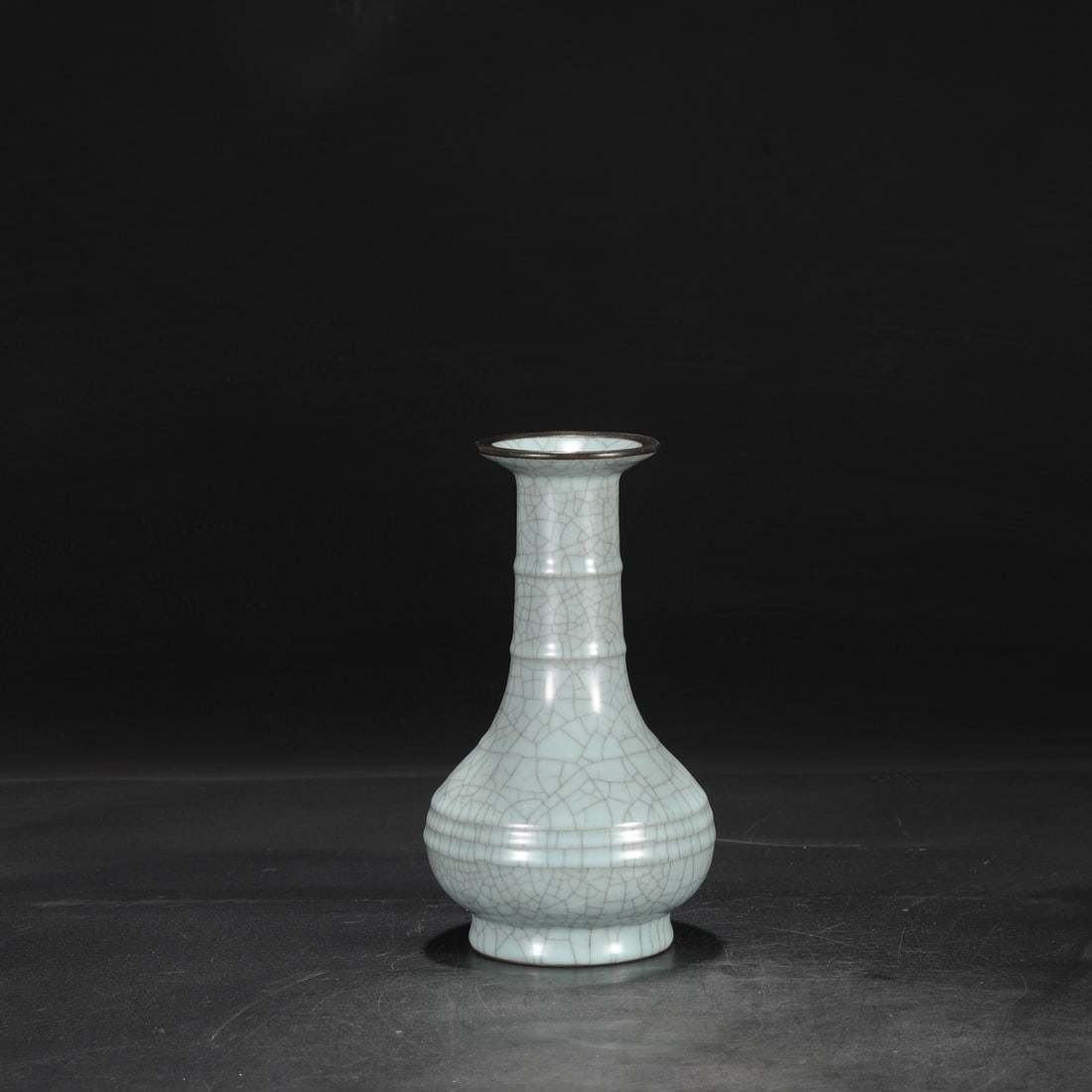 A Southern Song Dynasty official kiln celadon vase with a silver rim, used in the imperial court and: Dimensions: Height 24 cm, Mouth diameter 8.5 cm, Belly diameter 12 cm.