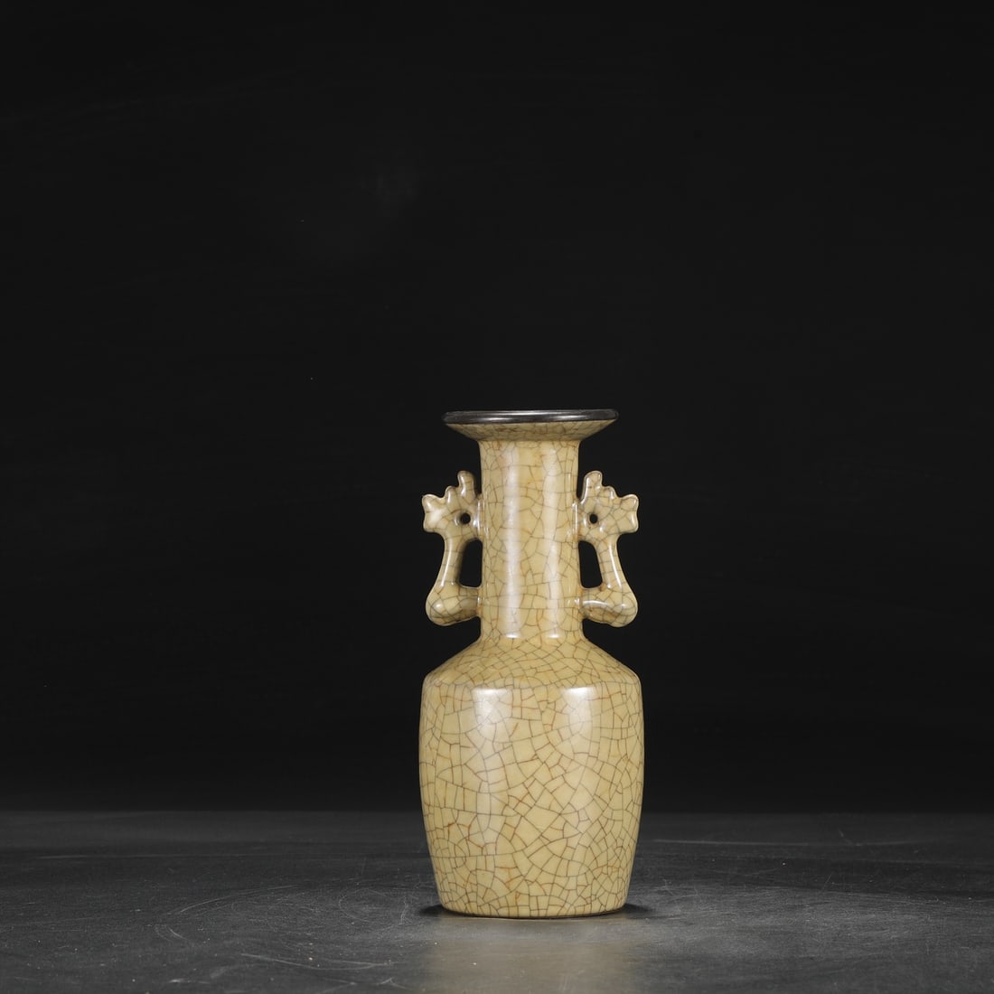 A Northern Song Dynasty Ge ware vase with a beige glaze, silver rim, and phoenix-ear handles,: Dimensions: Height 24 cm, Mouth diameter 8 cm, Belly diameter 10 cm.
