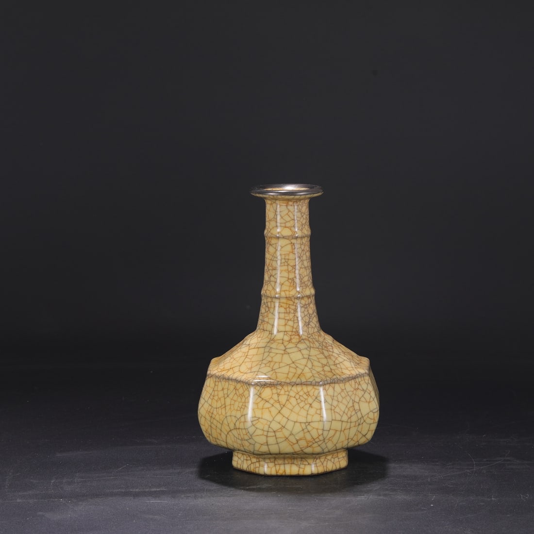 A large octagonal bamboo-shaped vase with a beige glaze and silver rim, formerly from the Northern: Dimensions: Height 27.5 cm, Mouth diameter 7 cm, Belly diameter 17 cm.