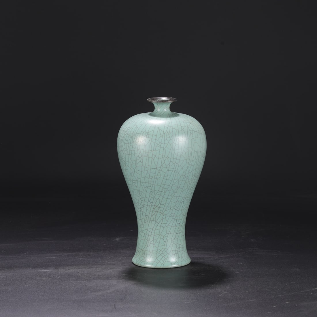 A large Northern Song Dynasty Ru ware celadon-glazed plum vase with a silver rim, formerly in the: Dimensions: Height 26.5 cm, Mouth diameter 5 cm, Belly diameter 14 cm.