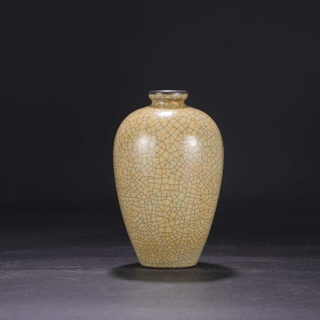 A large Northern Song Dynasty Ge ware vase with a beige glaze and silver rim, formerly in the (1 of 7)