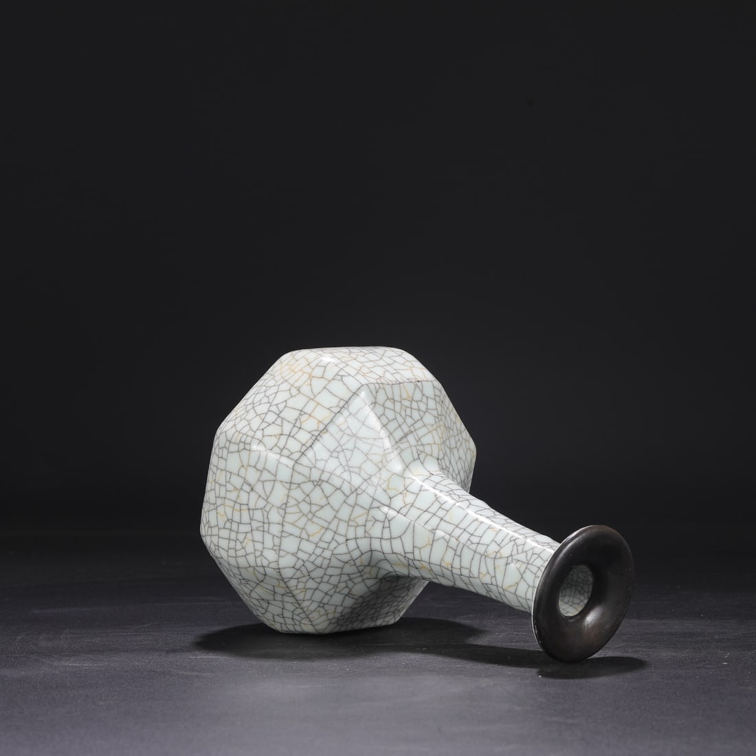 A Northern Song Dynasty Ge ware octagonal bamboo-shaped vase with a white glaze and silver rim,: Dimensions: Height 23 cm, Mouth diameter 7 cm, Belly diameter 14 cm.