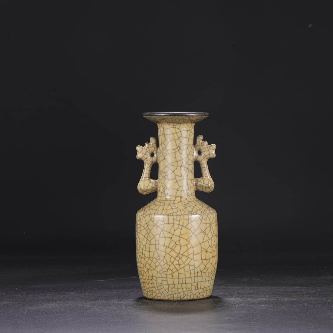 A Northern Song Dynasty Ge ware vase with a beige glaze, silver rim, and phoenix-ear handles,: Dimensions: Height 24 cm, Mouth diameter 8.5 cm, Belly diameter 10 cm.