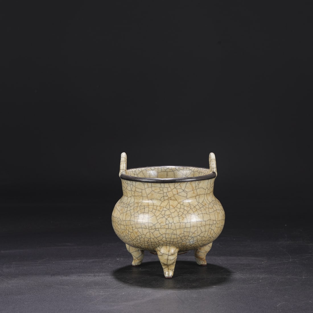 A Northern Song Dynasty Ge ware, beige-glazed, silver-rimmed imperial tripod censer, formerly in the (1 of 7)