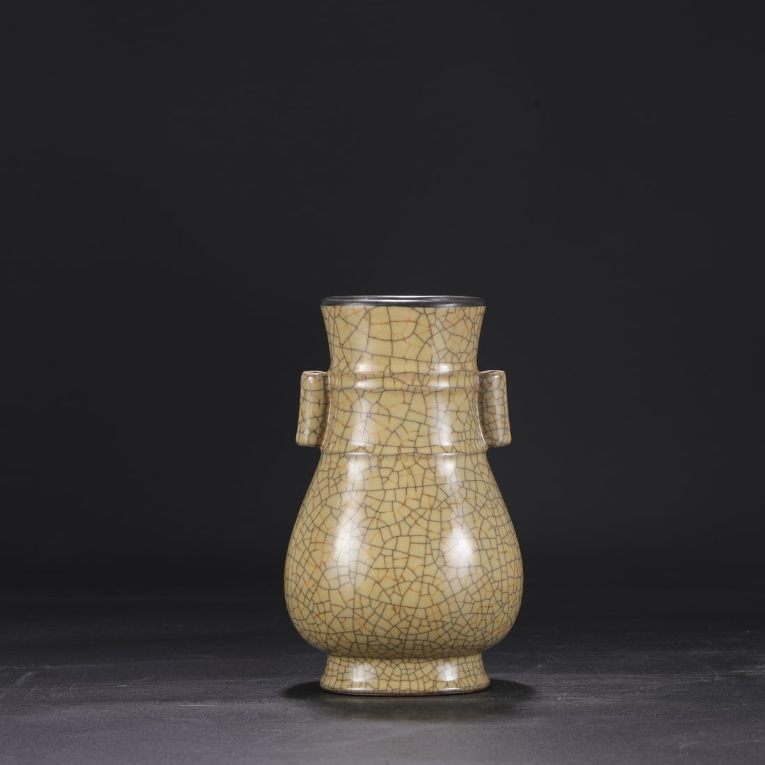 A Northern Song Dynasty Ge ware vase with a beige glaze, silver rim, and imperial handles, formerly: Dimensions: Height 23 cm, Mouth diameter 9.5 cm, Belly diameter 13.5 cm.
