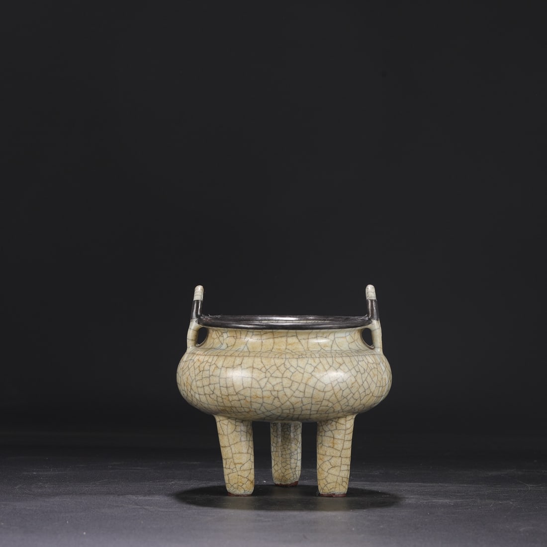 A Northern Song Dynasty Ge ware, beige-glazed, silver-rimmed imperial tripod-shaped incense burner, (1 of 7)