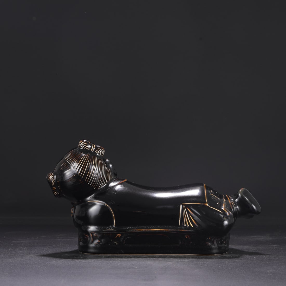 A Northern Song Dynasty Ding ware black-glazed child's pillow, bestowed by the imperial court and (1 of 8)