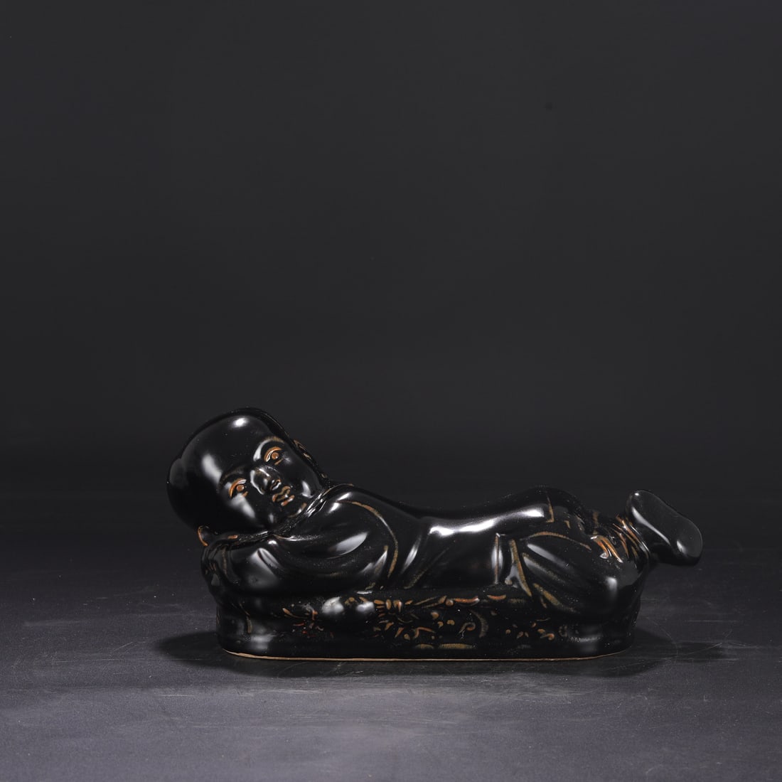 A Northern Song Dynasty Ding ware black-glazed child's pillow, bestowed by the imperial court and (1 of 8)