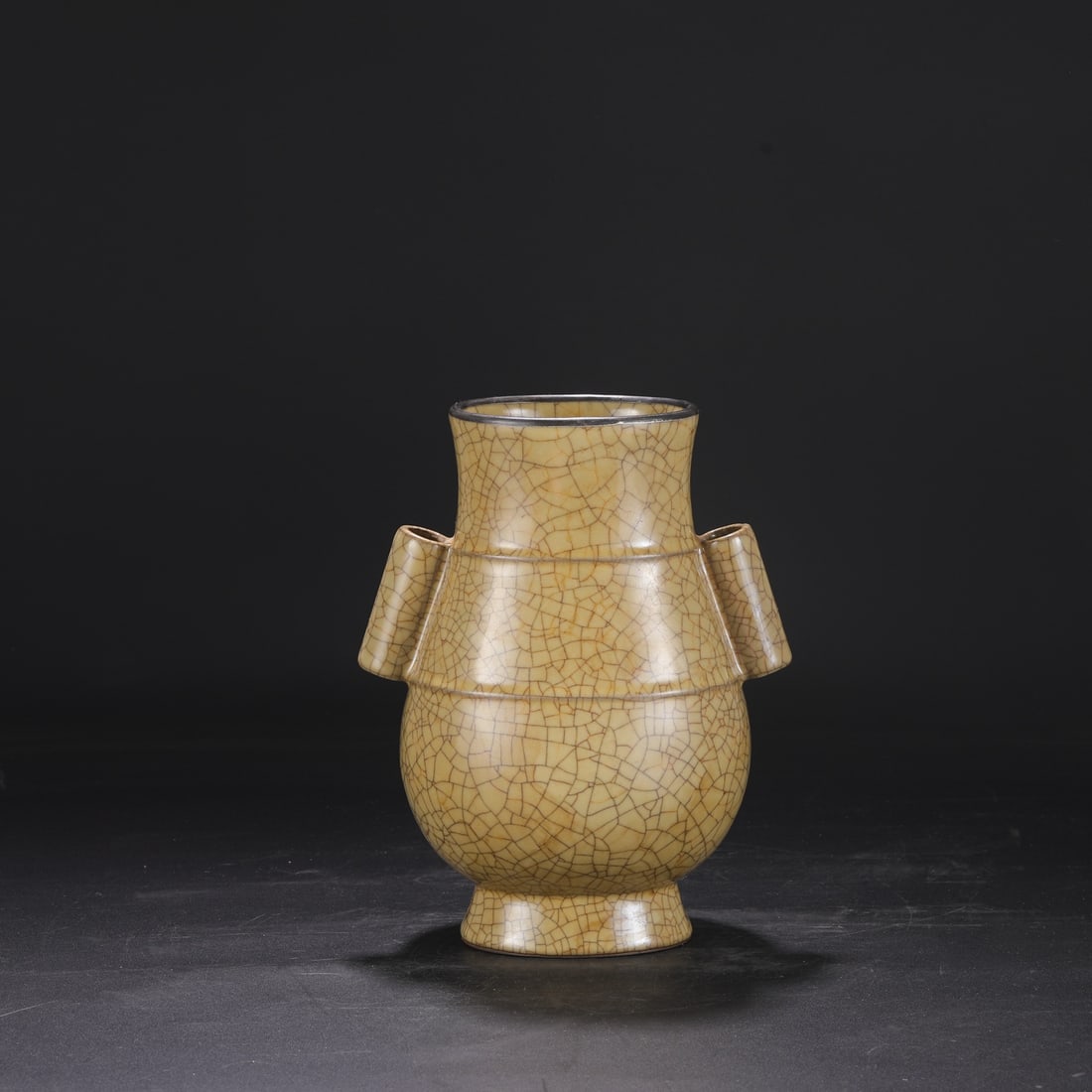 A Northern Song Dynasty Ge ware vase with a beige glaze, silver rim, and imperial handles, formerly: Dimensions: Height 28 cm, Mouth diameter 12.5 cm, Belly diameter 21.5 cm.