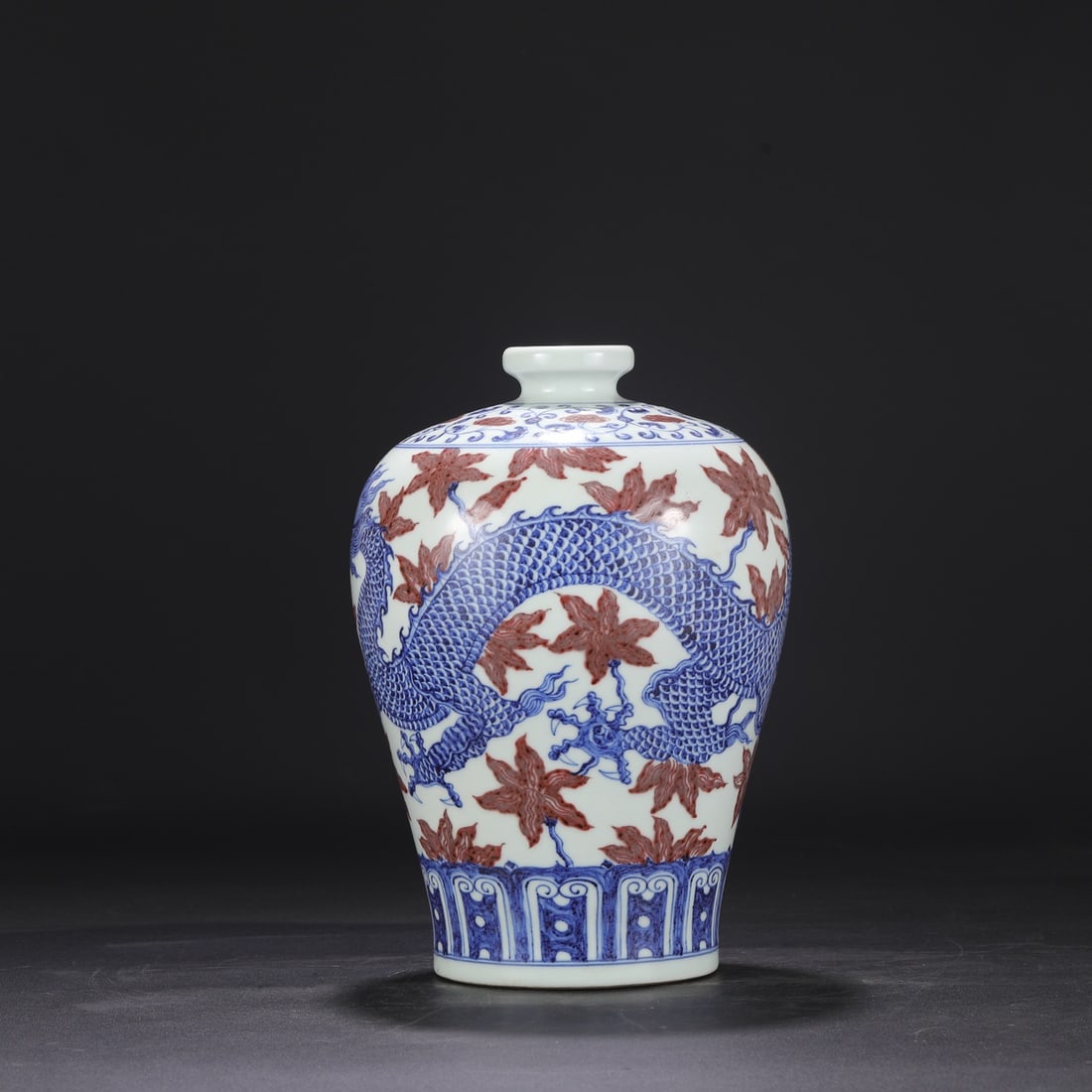 A large Ming dynasty Xuande blue-and-white underglaze red floral and dragon-patterned plum vase from (1 of 8)