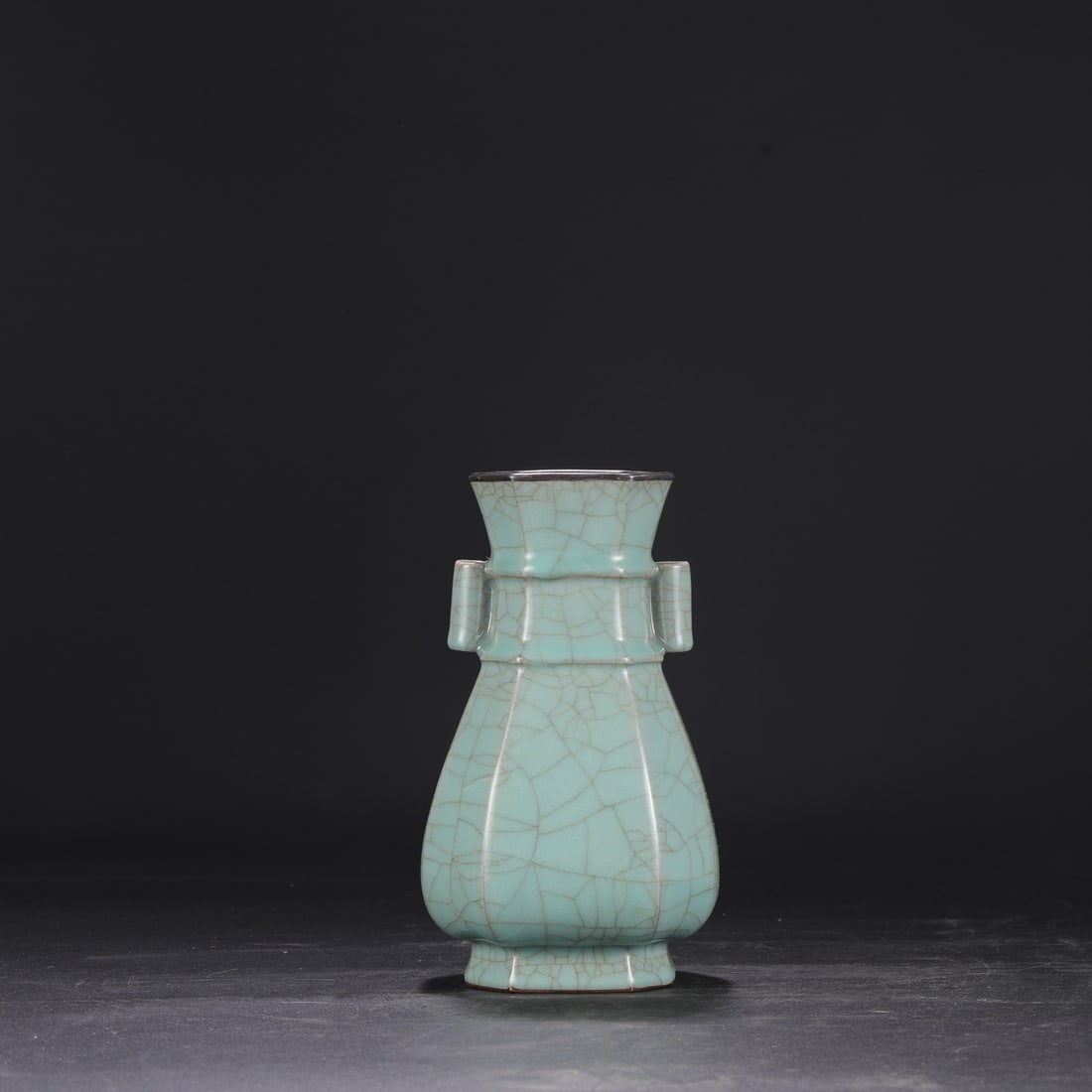 A Southern Song Dynasty official kiln celadon vase with a silver rim, used in the imperial court,: Dimensions: Height 22.5 cm, Mouth diameter 9 cm, Belly diameter 13 cm.