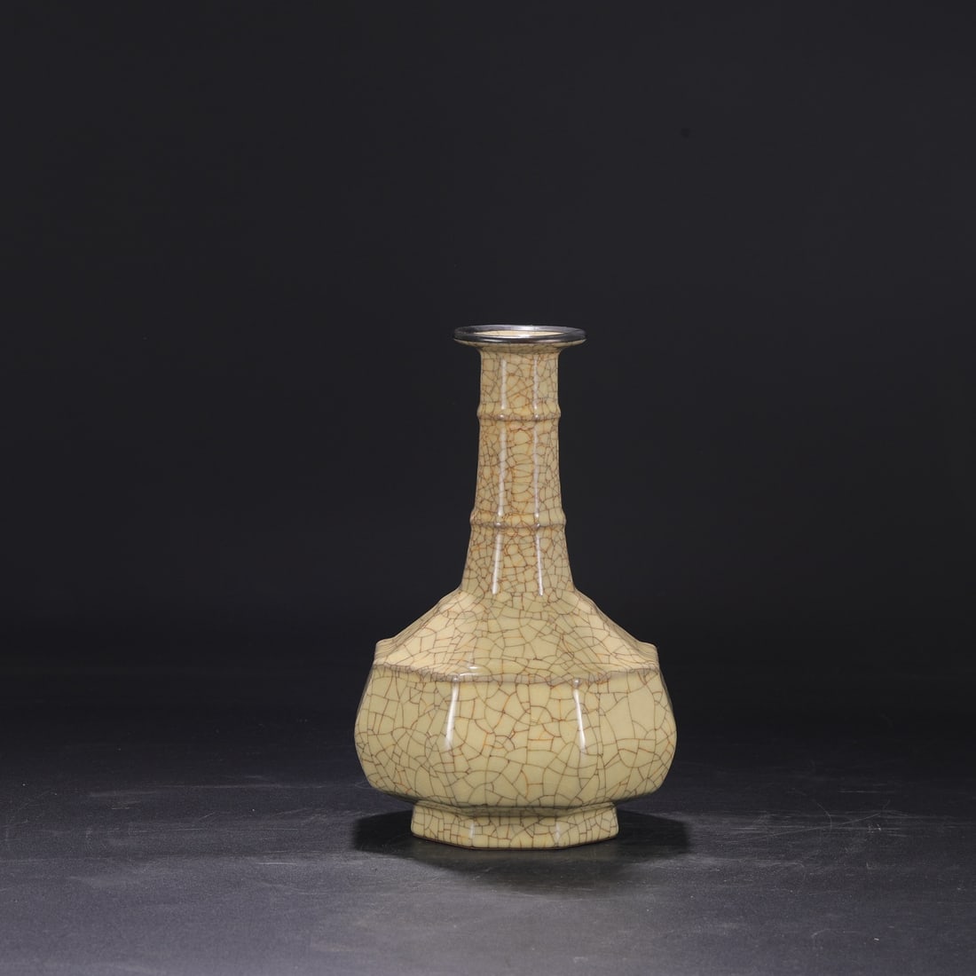 A large octagonal bamboo-shaped vase with a beige glaze and silver mouth, formerly from the Northern: Dimensions: Height 27.5 cm, Mouth diameter 7 cm, Belly diameter 17 cm.