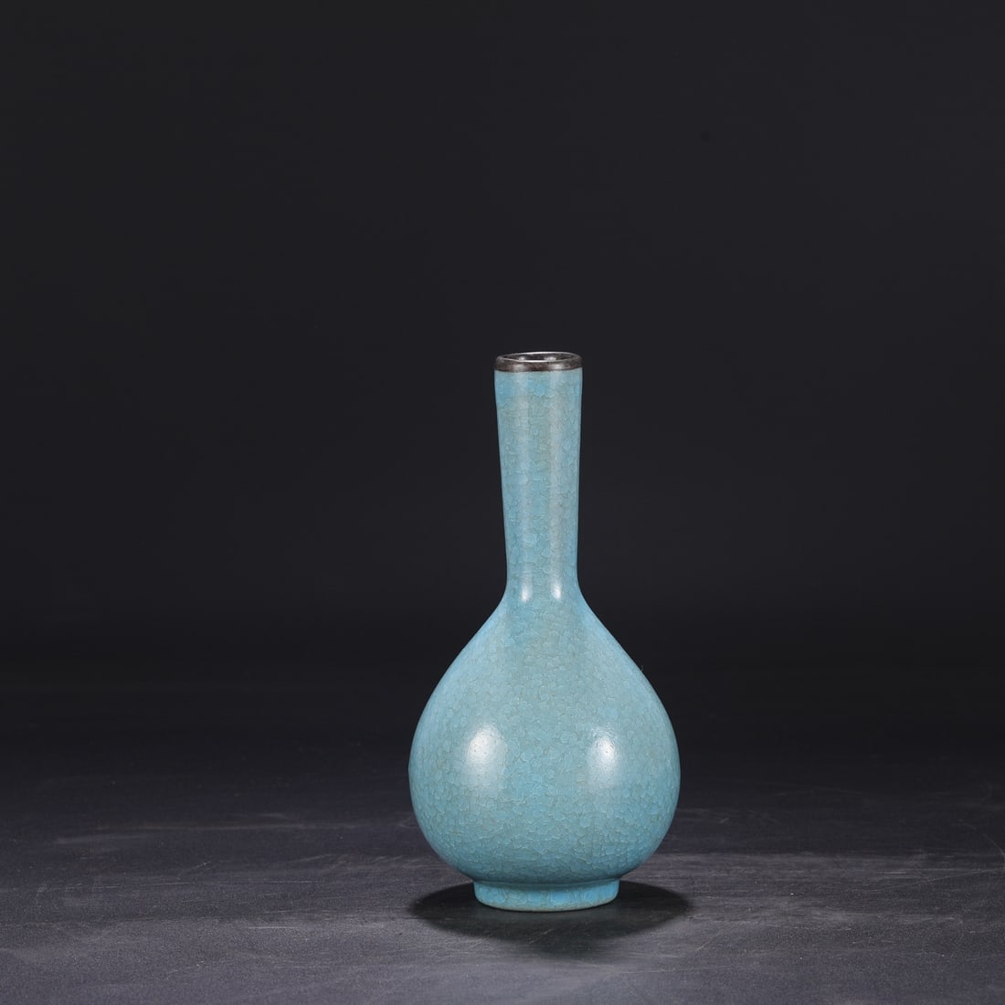 A Northern Song Dynasty Ru ware sky-blue glazed silver-mouthed vase with ice-crack pattern, formerly (1 of 7)