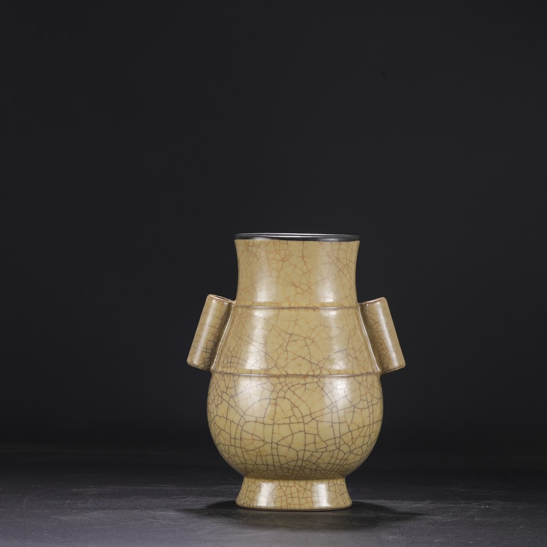 A Northern Song Dynasty Ge ware vase with a beige glaze and silver mouth, bearing an inscription by: Dimensions: Height 28 cm, Mouth diameter 13 cm, Belly diameter 21.5 cm.
