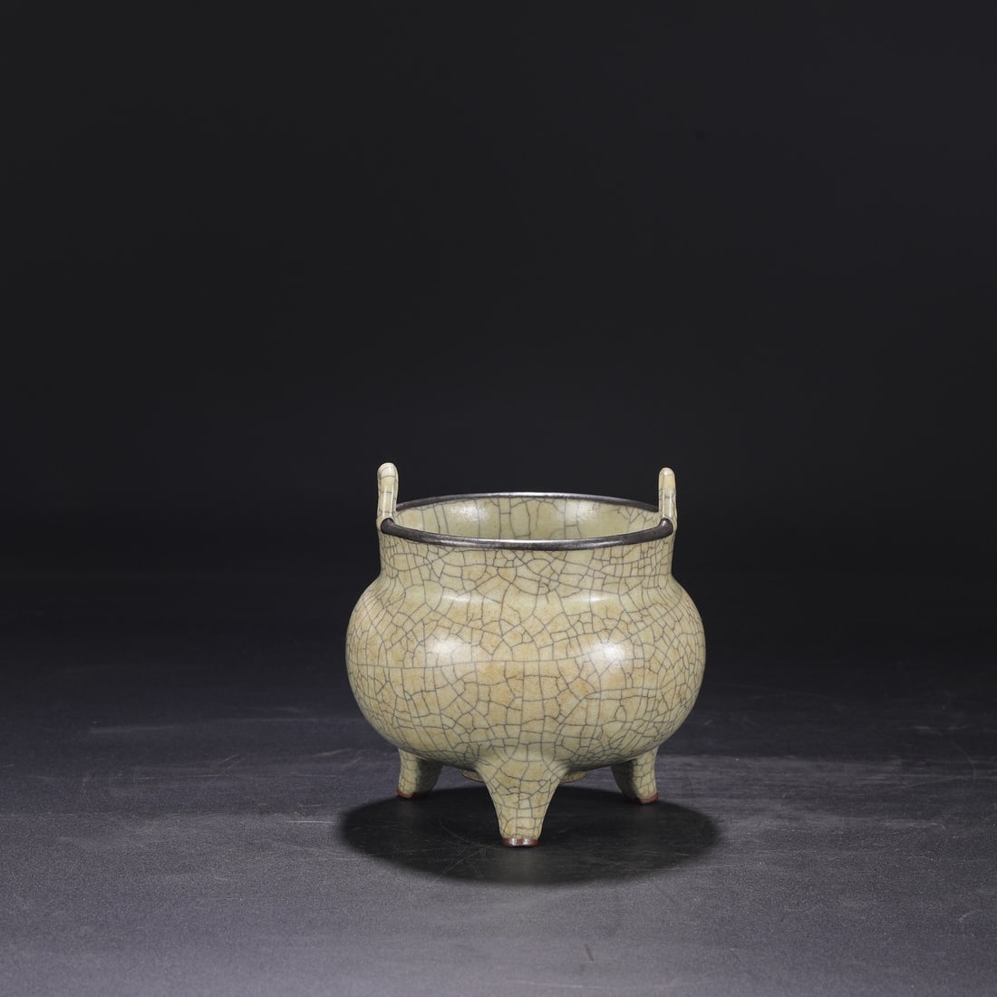 A Northern Song Dynasty Ge ware, beige-glazed, silver-rimmed imperial tripod-shaped censer, (1 of 8)