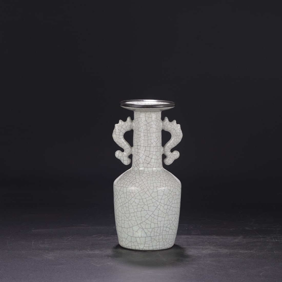 A Southern Song Dynasty official kiln celadon vase with silver mouth and fish-shaped handles,: Dimensions: Height 25 cm, Mouth diameter 9 cm, Belly diameter 11.5 cm.
