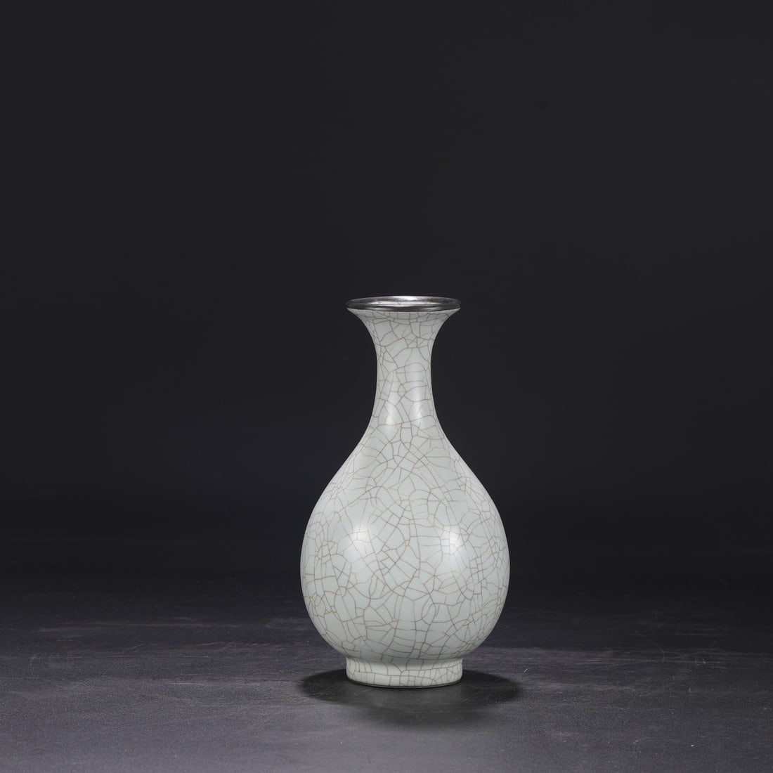 A Southern Song Dynasty official kiln celadon vase with a silver mouth and an inscription by Emperor: Dimensions: Height 24.5 cm, Mouth diameter 7 cm, Belly diameter 12.5 cm.