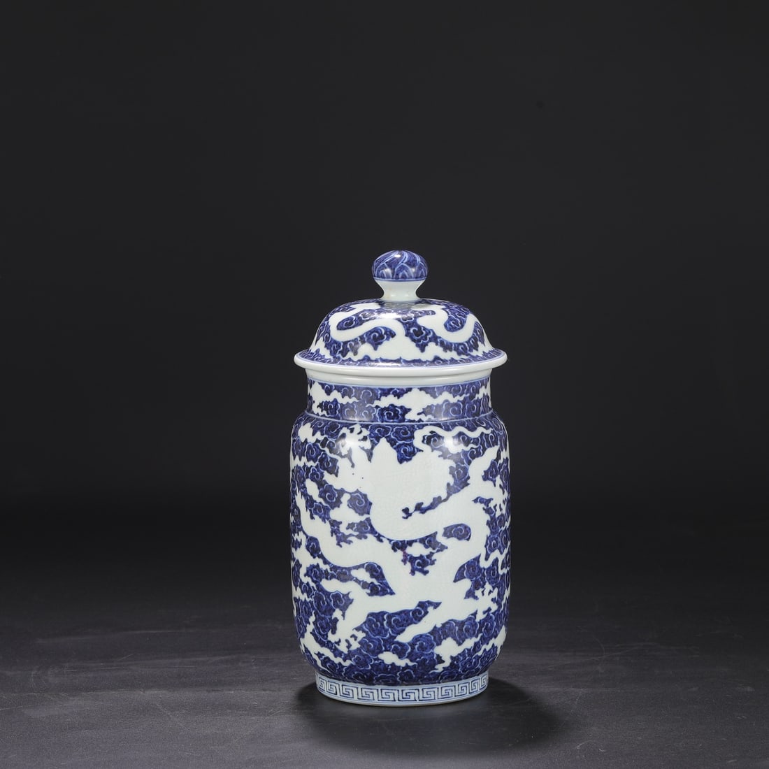 A large, carved blue-and-white porcelain jar from the Xuande period of the Ming dynasty, formerly in (1 of 8)
