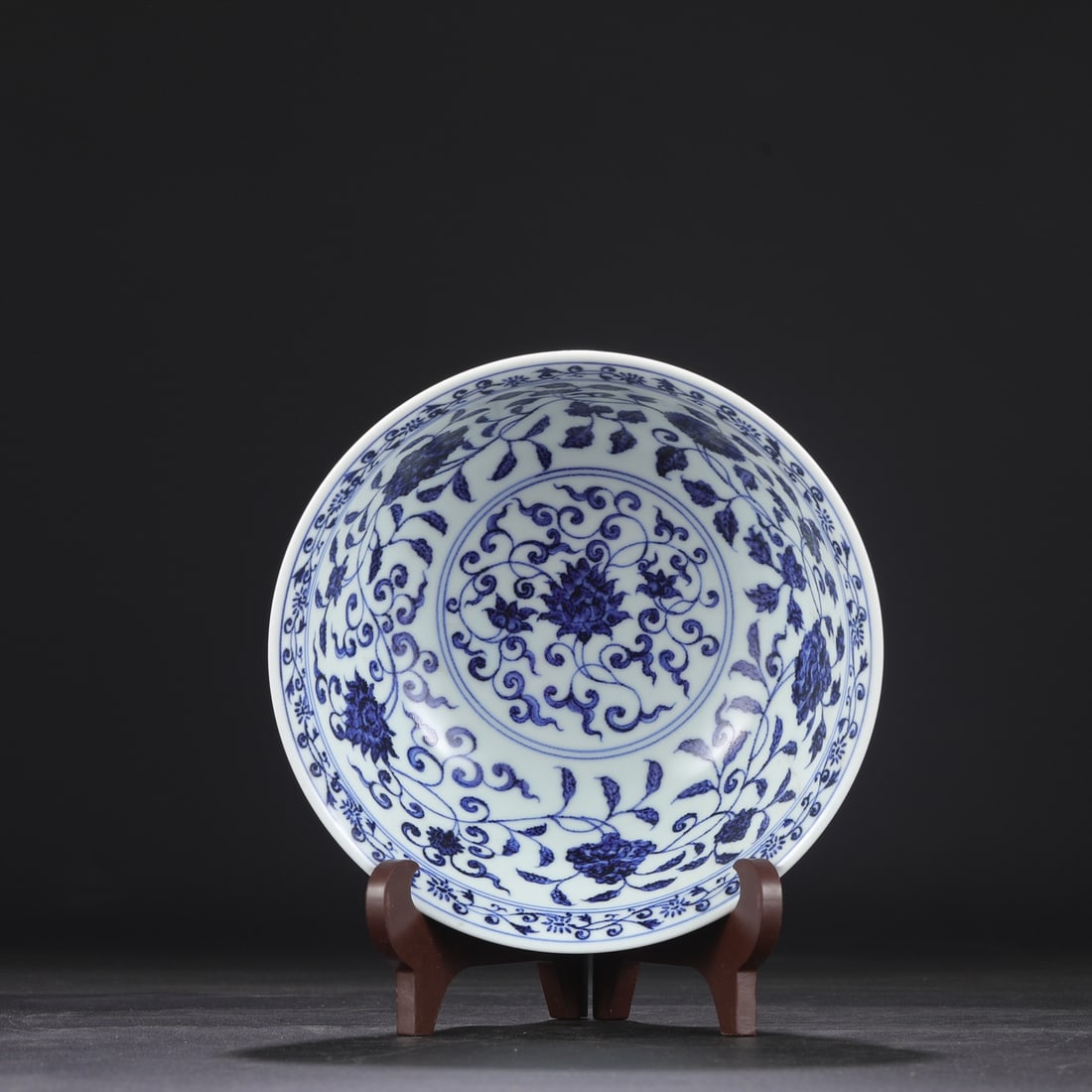 A large, deep-bodied blue-and-white porcelain bowl from the Xuande period of the Ming dynasty, (1 of 8)