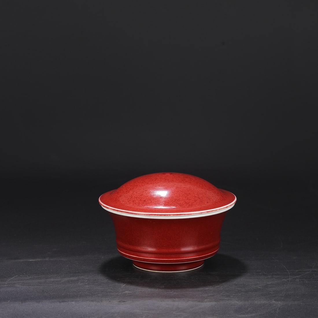 A Ming Dynasty Xuande period ruby-red glazed large covered bowl, formerly in the collection. (1 of 8)