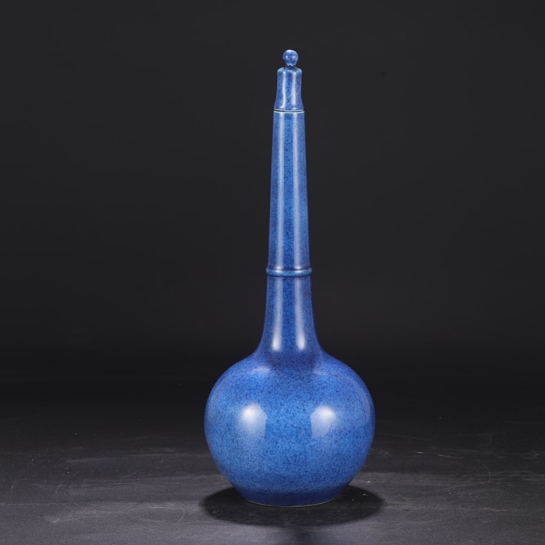 A Ming Dynasty Xuande period blue-glazed imperial vase, formerly in the collection. (1 of 8)