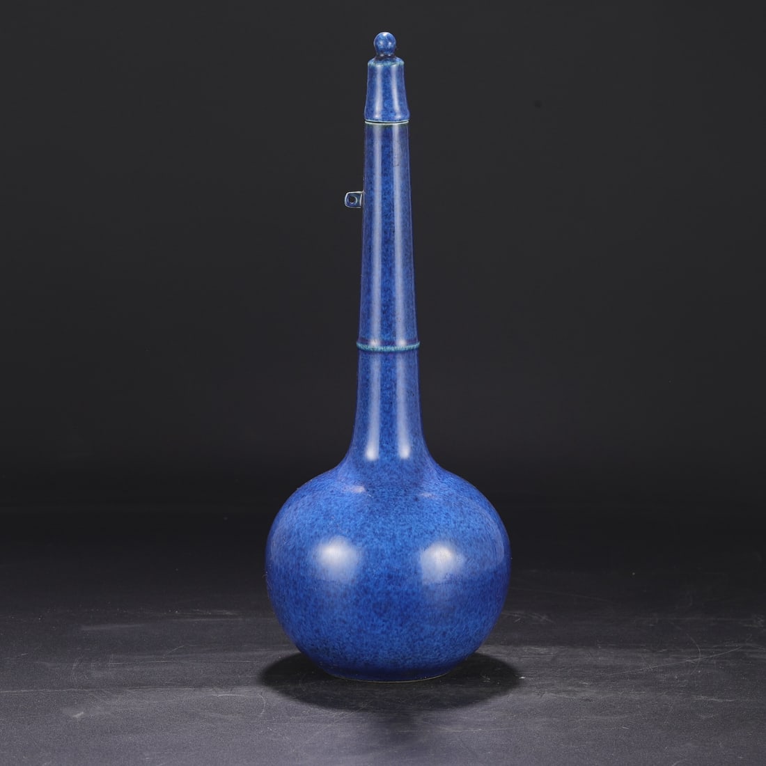 A Ming Dynasty Xuande period blue-glazed imperial vase, formerly in the collection. (1 of 8)