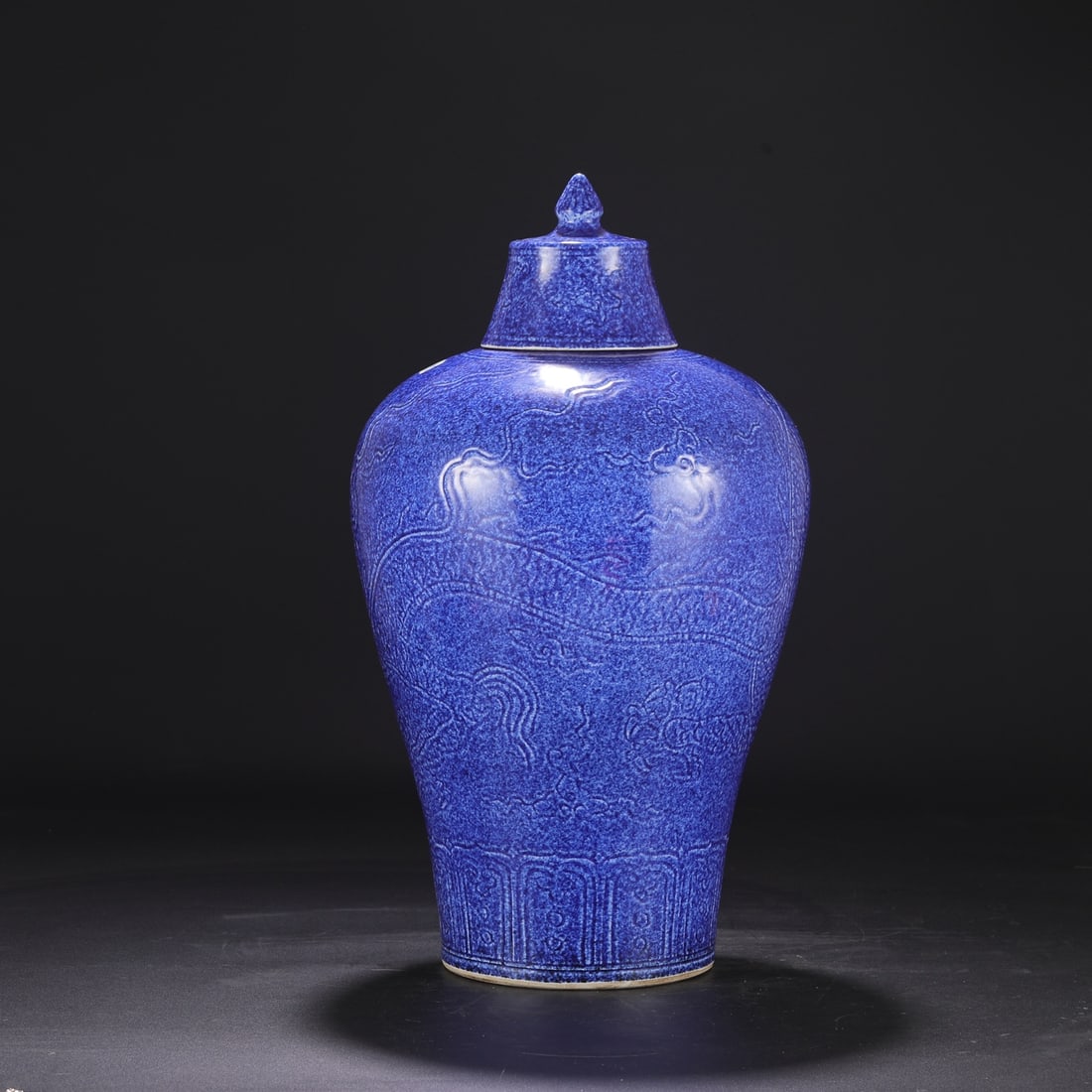 A large Ming dynasty Xuande period blue-glazed, carved cloud and dragon pattern covered plum vase, (1 of 8)