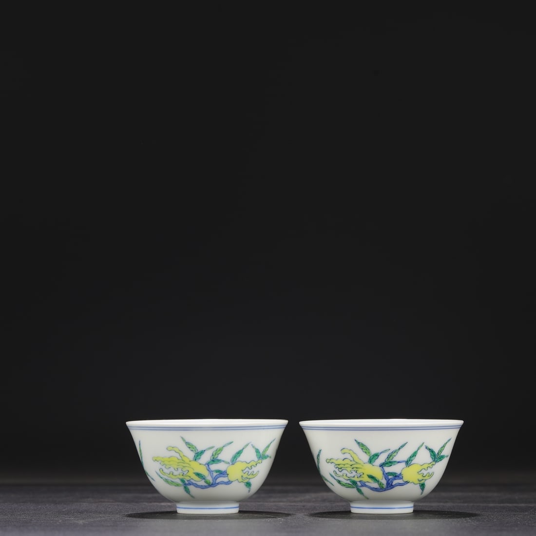 A pair of Qing Dynasty Yongzheng Doucai "Three Abundances" pattern cups, formerly in my collection.: Dimensions: Height 4.5 cm, Mouth Diameter 8.5 cm.